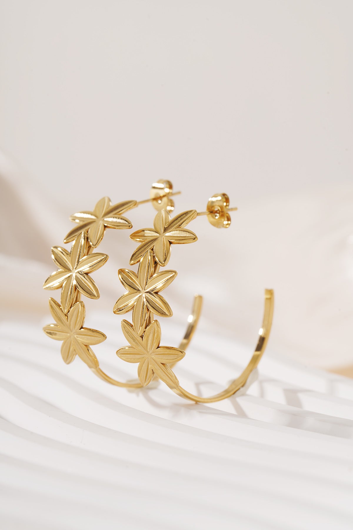 Hoop earrings adorned with flowers